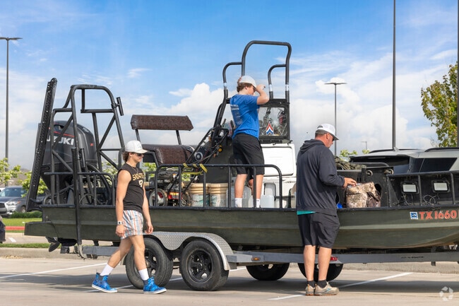 Families ready their boat for a fishing trip in Beach City.