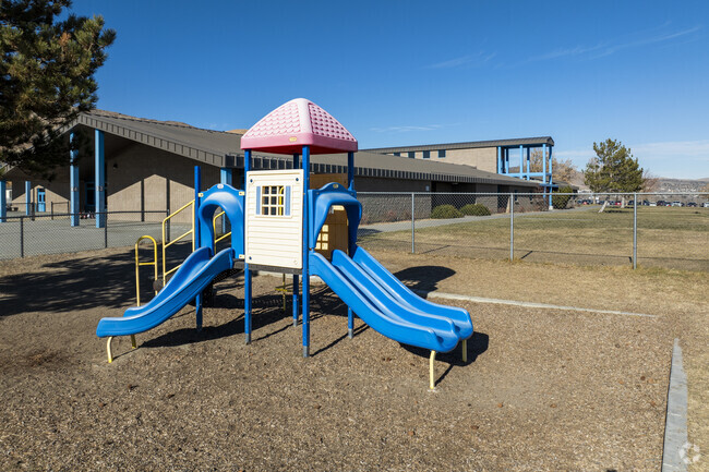 A small slide at the front of Lois Allen Elementary School.