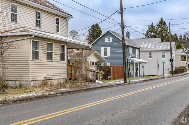 Large coal mining era housing sits along the streets in Shade Township.