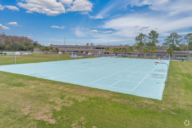 Hill Middle School features a basketball court outside.