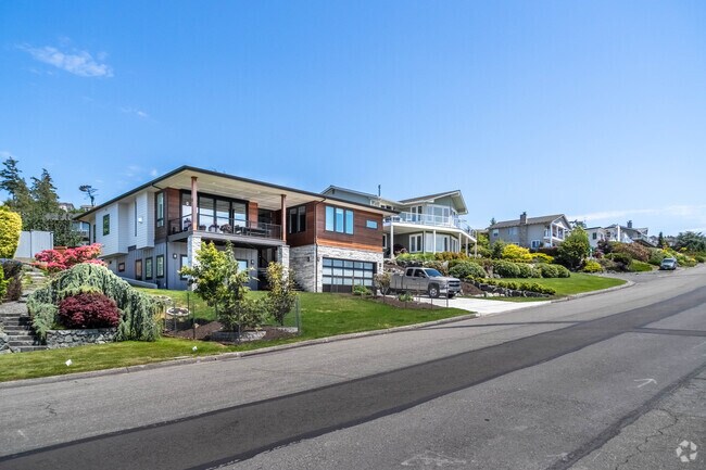 A row of high priced homes in the heart of Skyline featuring floor to ceiling windows.