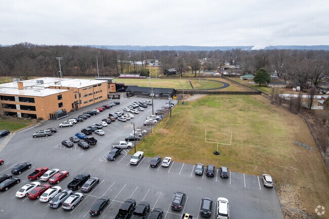 The student population of Holy Cross High School is 237.