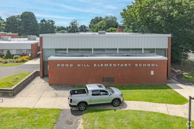 Pond Hill Elementary School is located at 299 Pond Hill Road in Wallingford, CT.