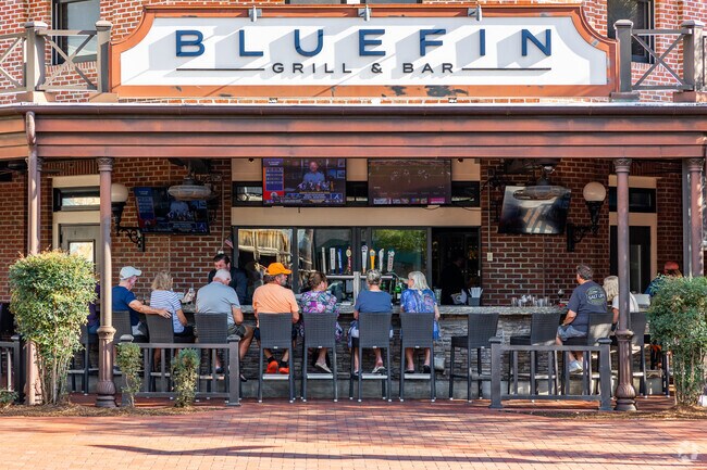 Residents of The Villages enjoy refreshments and food at the Blue Fin.