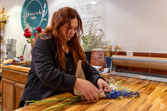 Cultivate Coffee + Flowers is a unique coffee shop that features a pay by stem flower shop.