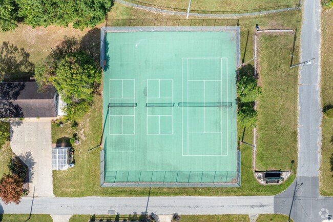 Practice your serve on the tennis courts at Cope Bennett Park.