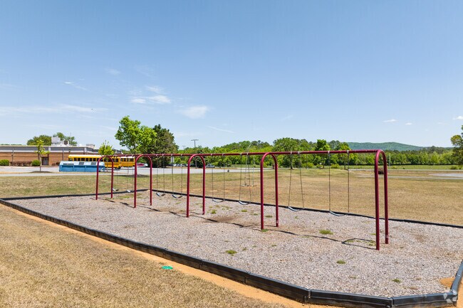 White Elementary School's students can enjoy the swing sets.
