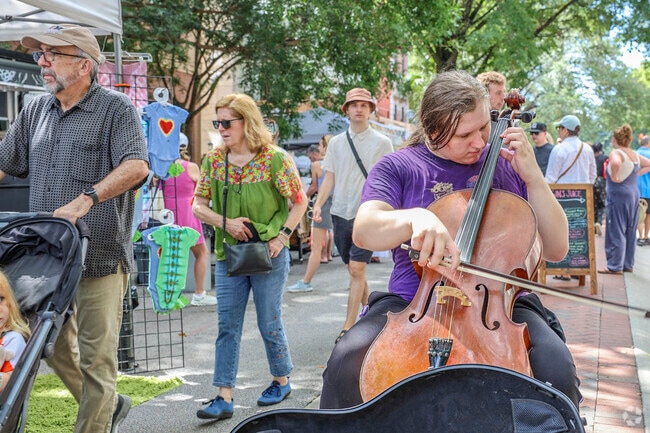 Live music like a cellist brings vibrant energy to Soda City Market near West Columbia.