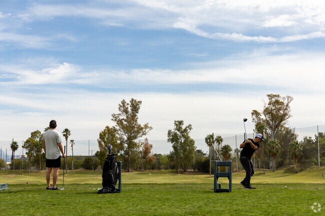 Practice your golf swing at the Randolph Dell Driving Range.