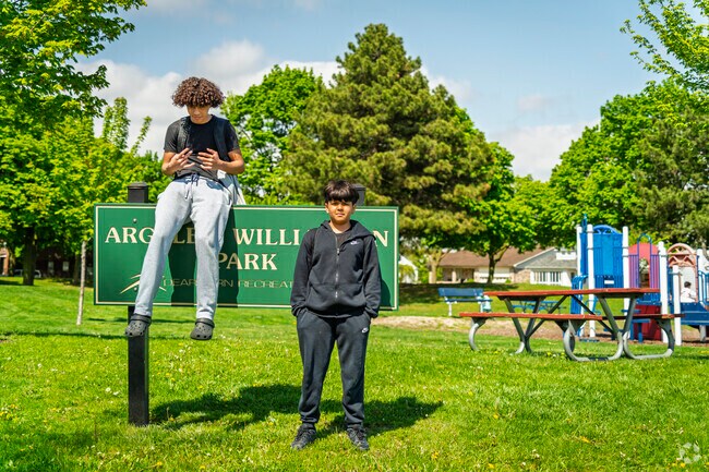 Locals hang out at Argyle-Williamson Park after school on a warm spring day.