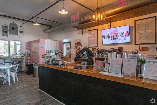 Happy Cat Cafe serves Southeast Community Association their coffee in a calm, quiet lounge.
