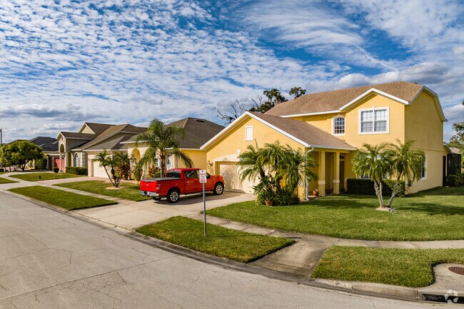 A colorful row of homes in The Oaks Golf & Community in Lake Toho.