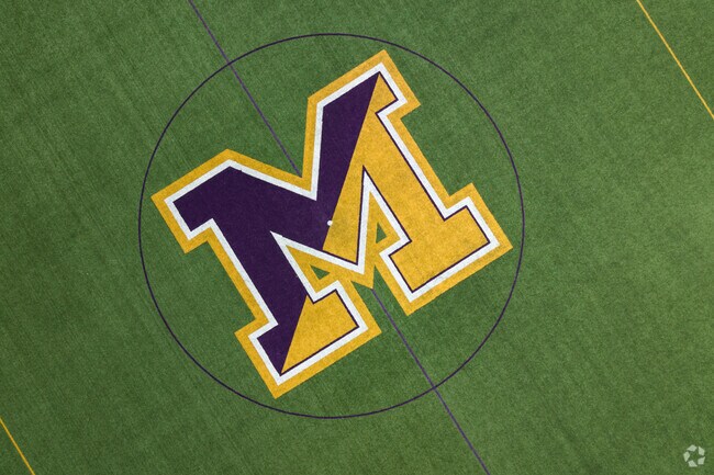 Aerial view looking down on Mount Saint Joseph's Academy logo on their athletic field in Flourtown.