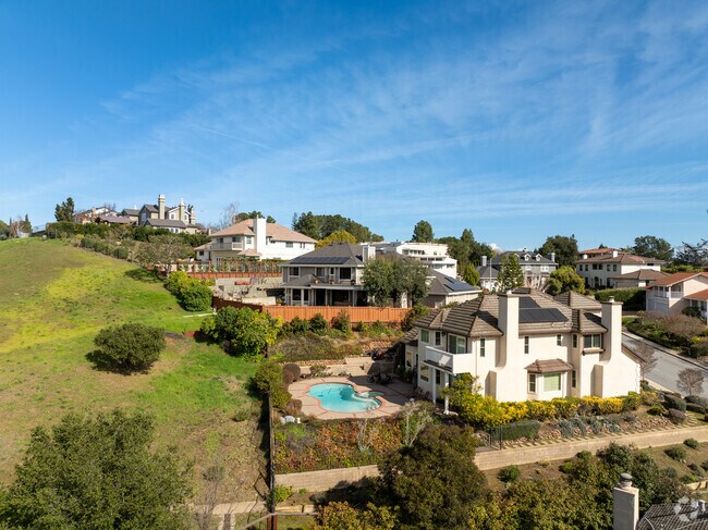 Nestled snugly atop the rolling hills of Emerald Hills neighborhood.