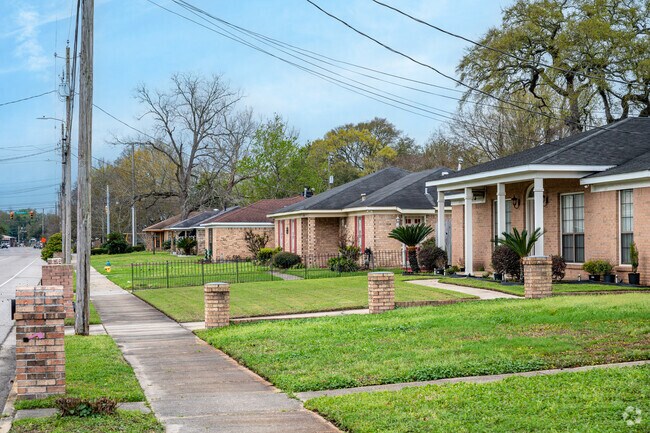 Brick homes in the Texas Street neighborhood are bordered by sidewalks.