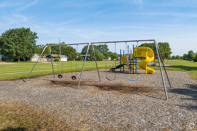 Kids can climb on the playground at Prairie Wind Park in Park City.