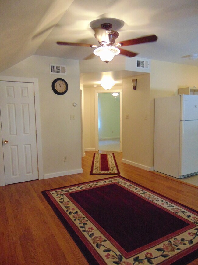Living room towards hallway to bedrooms, bath, and laundry.