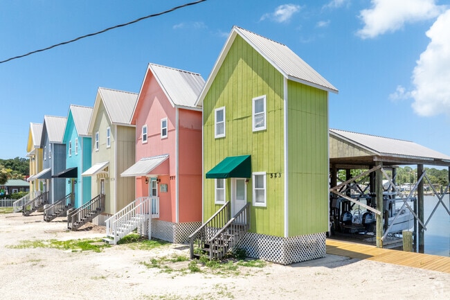 These colorful houses are a  solution to less expensive waterside property on Dauphine Island.