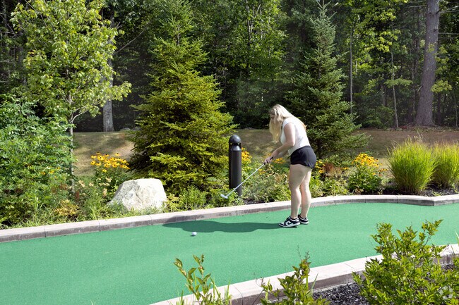 Residents play a round at Wicky Ralph's Ice Cream & Mini Golf in Acton, Maine.