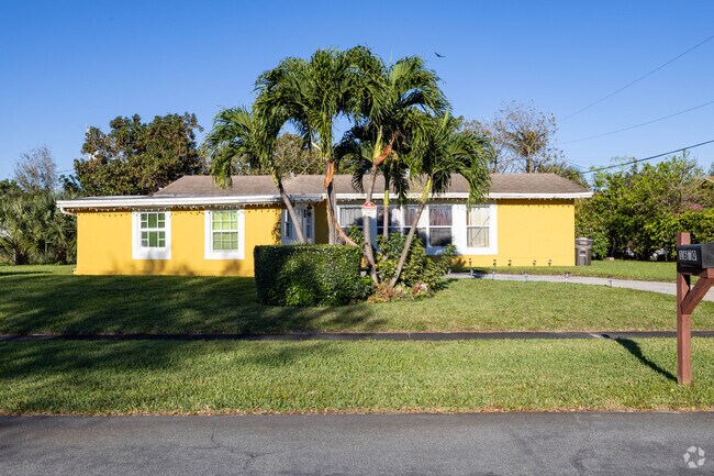 Well manicured with palm trees this ranch is on a quiet street in Mangonia Park.