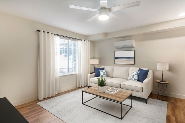 Renovated Package II living room with hard surface flooring