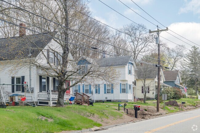 Above the old railroad line, early 20th century homes make a pleasant vista.
