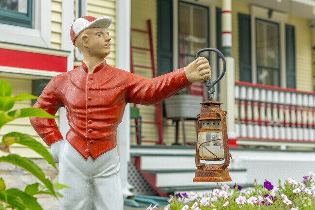 A lawn jockey stands in front of this Victorian-style house in Saint Paul.