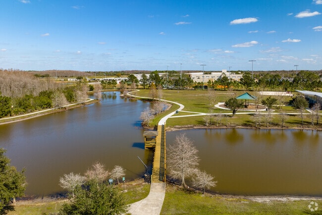 Walk along the wooded boardwalk in Meadow Woods and take in the lake views.