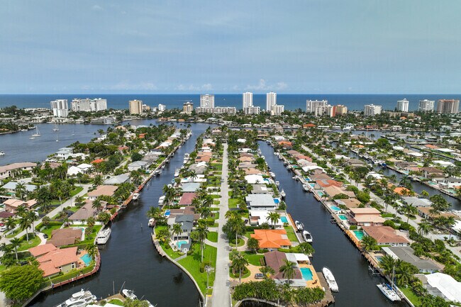 Aerial view of Santa Barbara Estates with waterways separating houses.