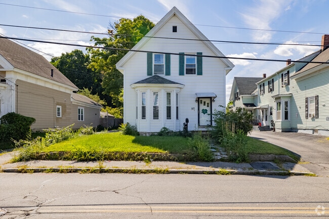 Queen Anne styled homes in Lowell feature steep roofs and bay windows.