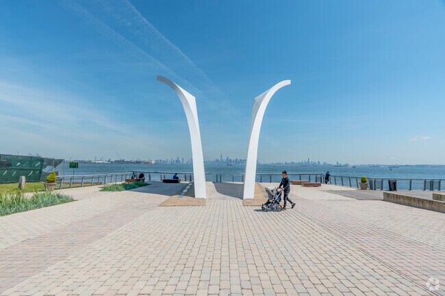 The September 11th Memorial, two vertical winged structures, is along the water in St. George.