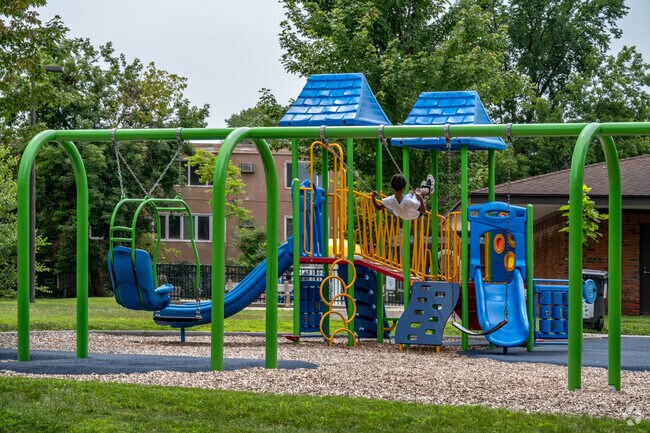 Families enjoy the playground at Cleveland Park.