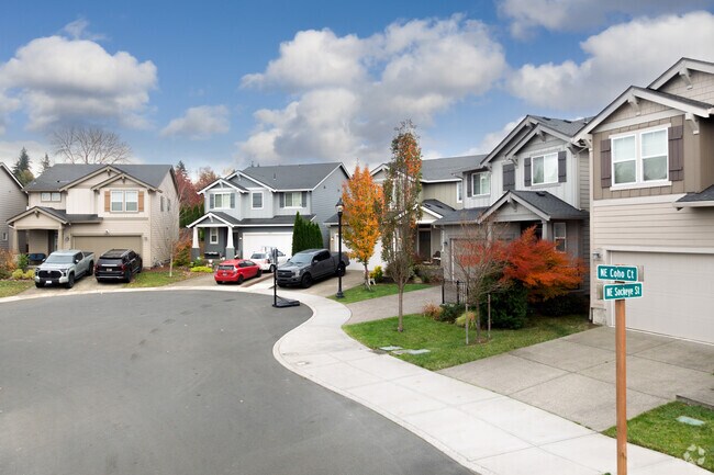 Well-manicured lawns are a defining feature of many homes in Wood Village.