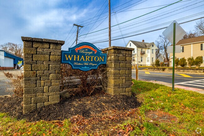 The welcome sign of the neighborhood proudly stands at the entrance of the town.