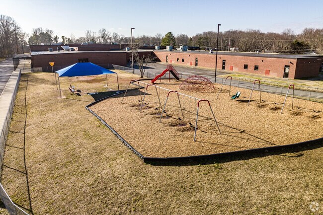 Watauga Elementary School has a larger playground and green space.