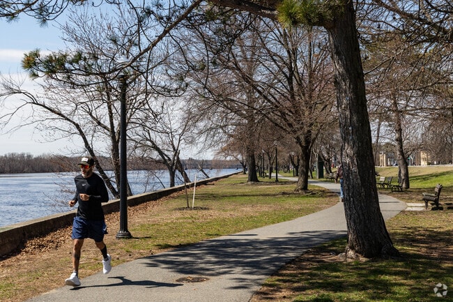 Runners enjoy the fresh air along the Merrimack River near Lower Highlands.