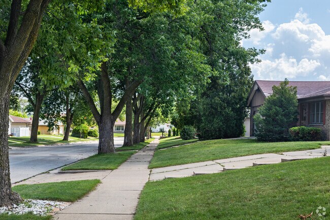Homes loaded with charm sit on green lawns behind tree-lined streets.