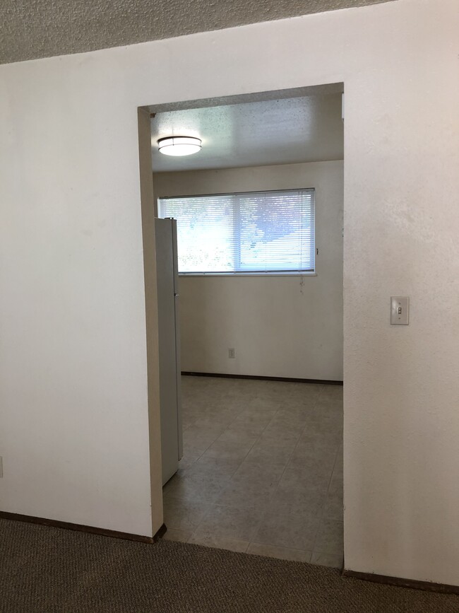 view from Living Room to Dining and Kitchen
