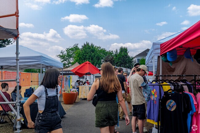 Locals enjoy walking down to the lined booths of the venders at Gilman Park Marketplace.