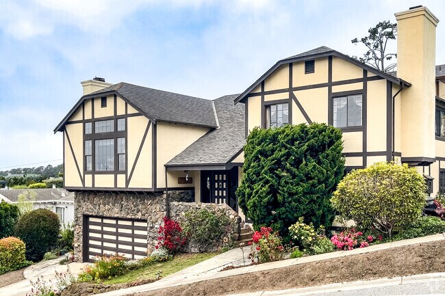 Large French Prarie Homes hug the hills of El Granada.