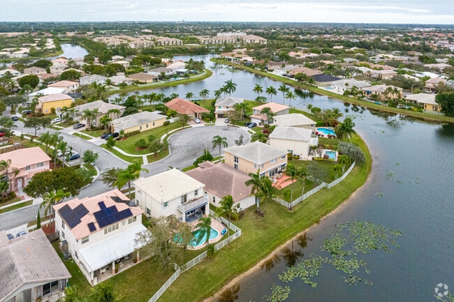 Aerial overview shows waterfront houses in Lakes Of Western Pines.