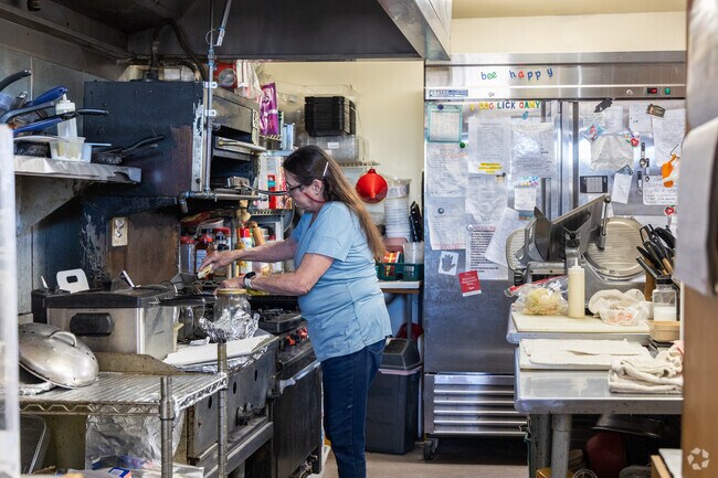 The owner at Krestrel Kafe in Tucson will take your order and make your food.