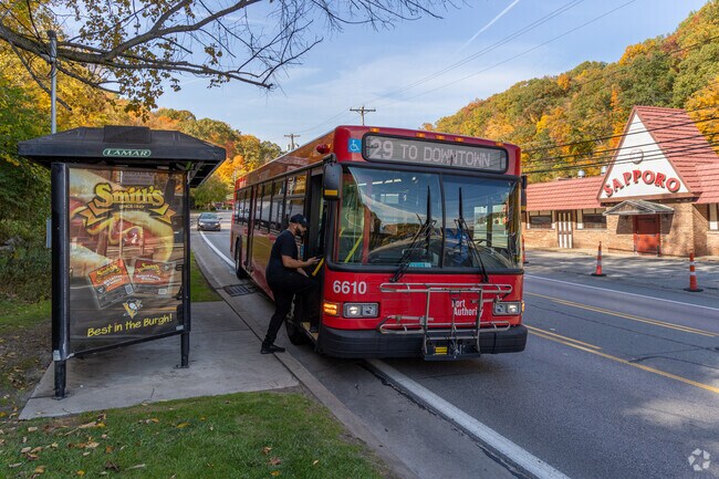 Thornburg residents come down to Steubenville Pike to get at PRT bus.