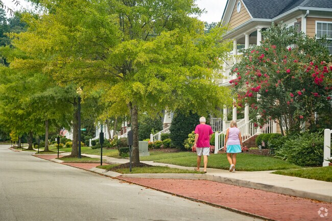 East Brainerd residents walk the streets of their well-manicured neighborhood.