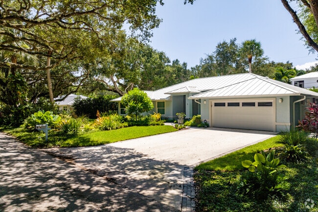 Sewall's Point homes are surrounded by lush landscaping.