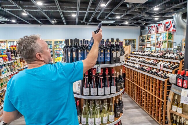 Pick out your favorite wine at Islander Market near Venetian Isles.