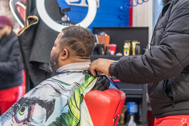 Rock a new haircut at D´Bakana Barbershop with friendly company in Hillside.