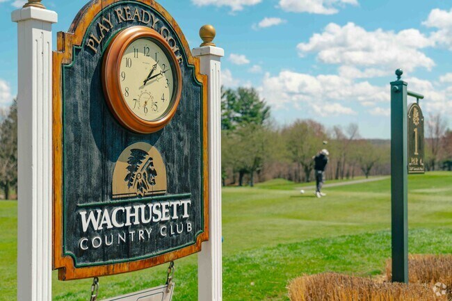 Golfers practice their swing at Wachusett Country Club in West Boylston.