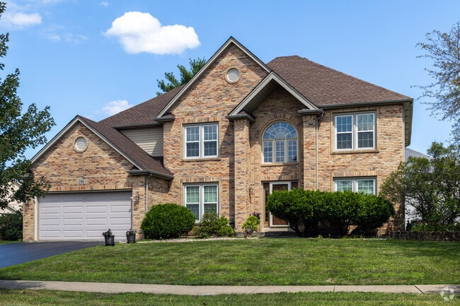 Beautiful new build homes with immaculate yards and mature trees are common in Cider Creek.