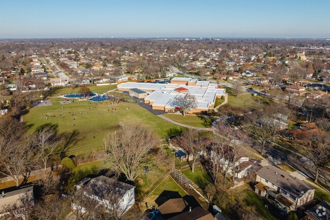 Robert Frost Elementary features a playground with open fields for children to play.